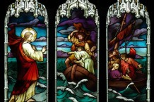 Set of three stained glass panels showing Christ calming the waters of the Sea of Galilee
