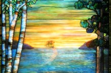 Tiffany-inspired stained glass art showing a spectacular sunset on the water