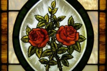 A lovely stained glass panel showing two roses in full bloom