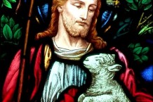 Stained glass art showing the "Good Shepherd" holding a member of His flock