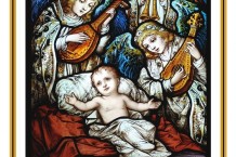 Stained glass showing the Baby Jesus surrounded by angels