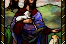 Religious stained glass depicting Christ as a shepherd